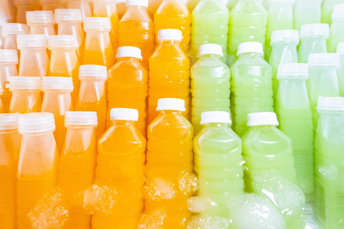 orange juice and guava juice in plastic bottle